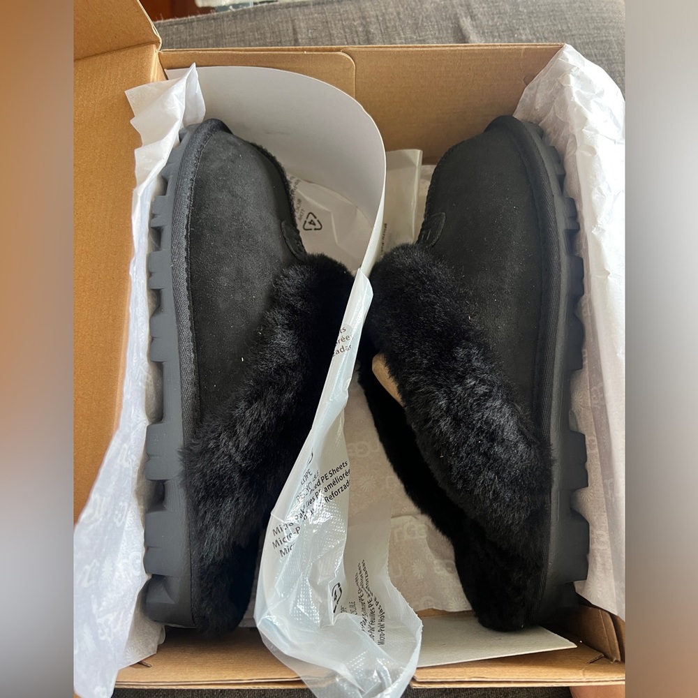 Size 10 black Ugg slippers (women’s). New in box